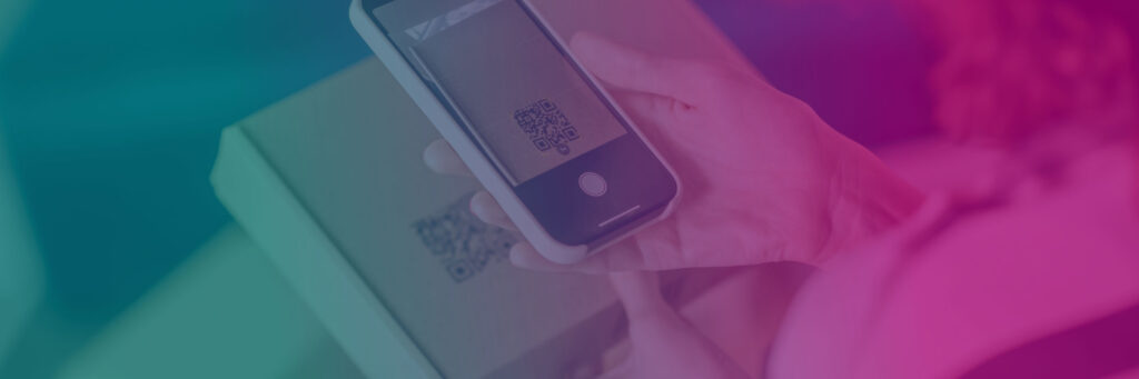 A person scans a QR code on a cardboard box using a smartphone. The image features Sandy Alexander’s signature colorful gradient overlay in vibrant teal and pink tones.