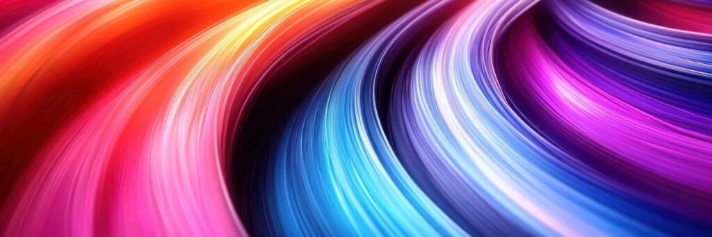 Vivid abstract image by Sandy Alexander featuring sweeping, curved streaks of bright colors—red, orange, pink, blue, and purple—creating a dynamic and fluid sense of motion and energy.