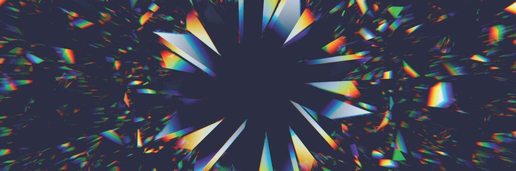 Abstract digital artwork by Sandy Alexander featuring sharp, angular shards radiating outward from a dark central point. The spectrum of rainbow colors and reflections against a deep black background creates a dynamic, energetic effect.